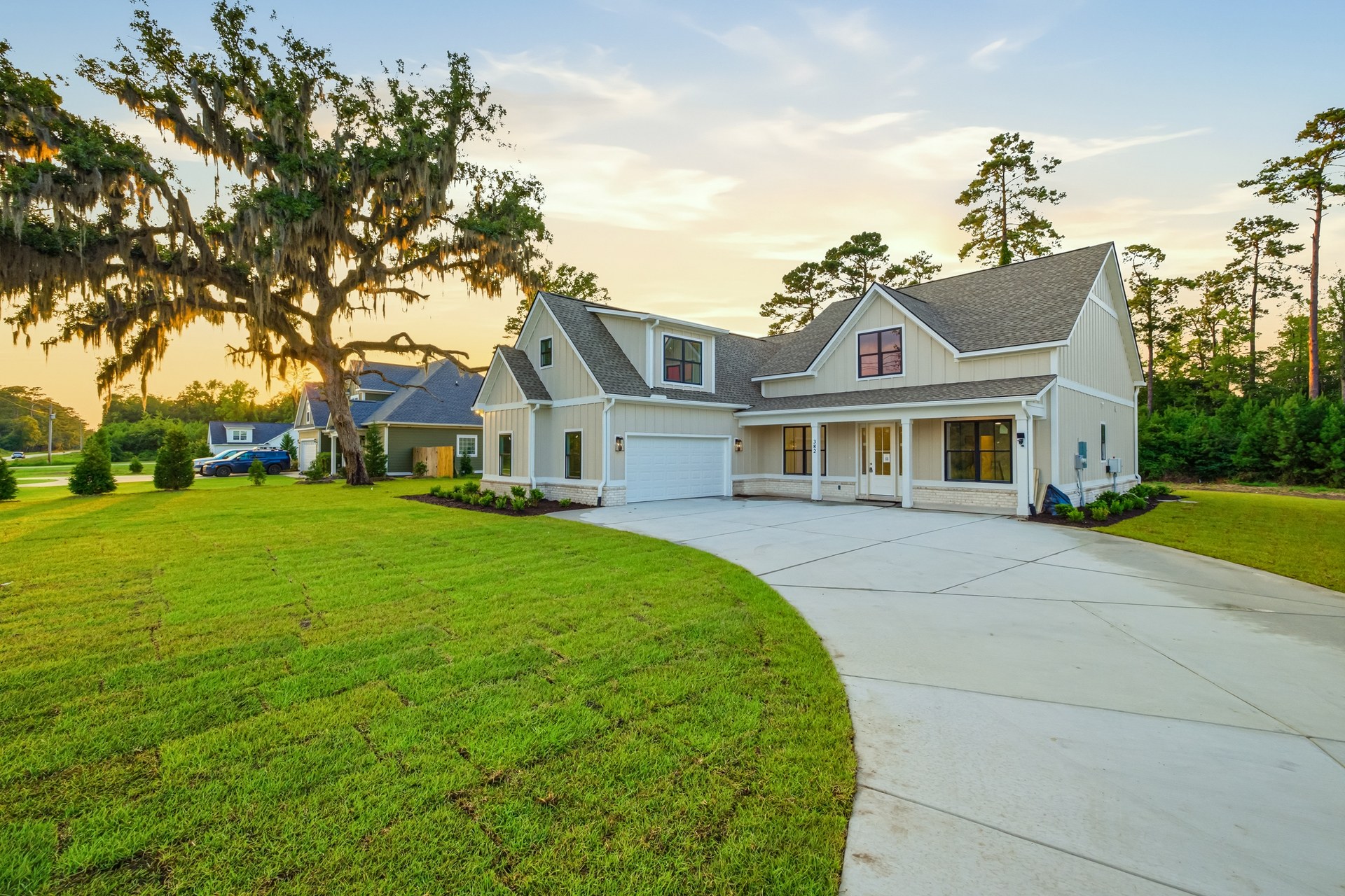 382 Ridge Road — board-and-batten farmhouse under live oaks in Galivants Ferry